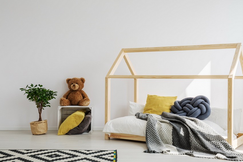 minimalist children's room with a bed frame resembling a home  